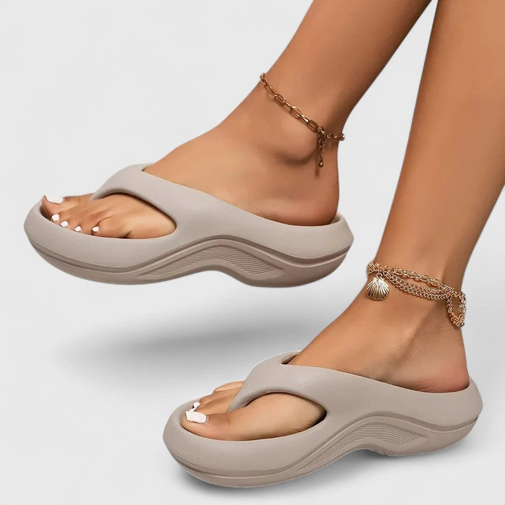 Melba Lane – taupe grey cushioned thong sandals worn stepping forward, AU women's sizes