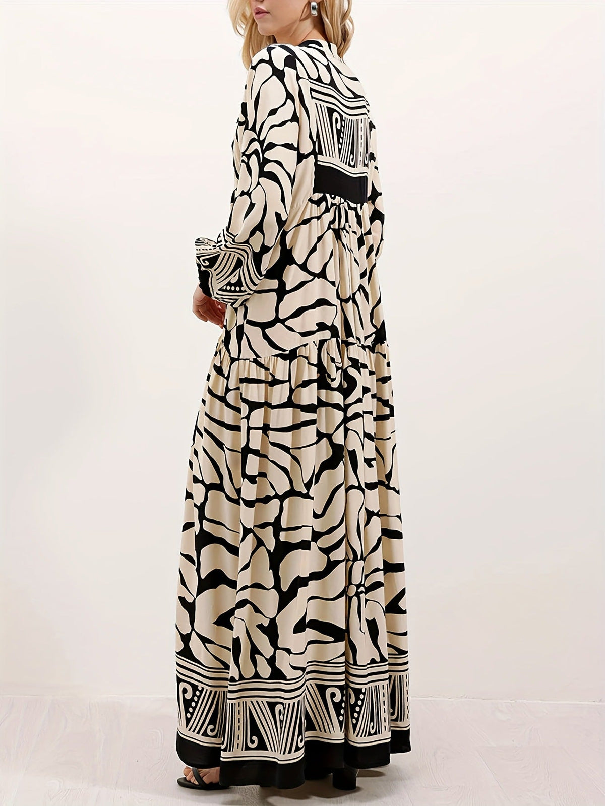 Melba Lane – cream and black print maxi dress worn with a clutch bag, AU women's sizes