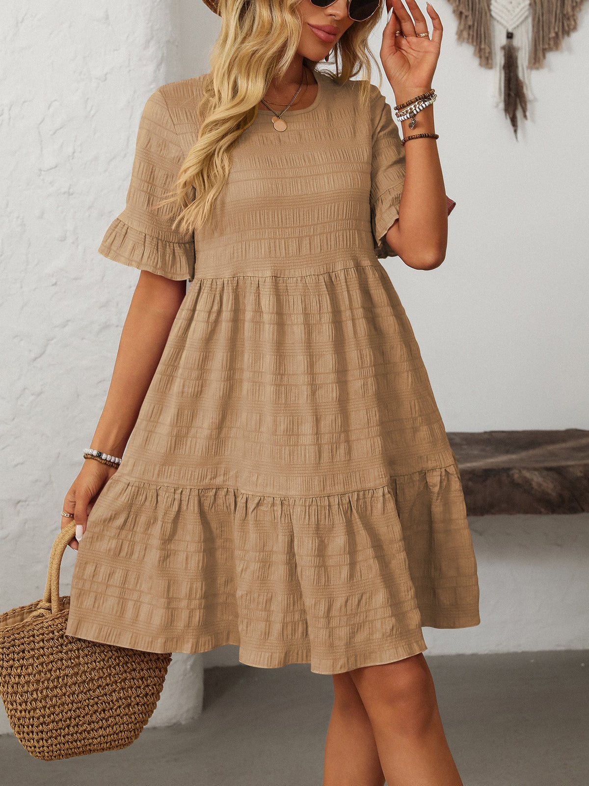 Melba Lane – Studland tan textured tiered short-sleeve dress, front view with a straw tote on the arm, AU women's sizes