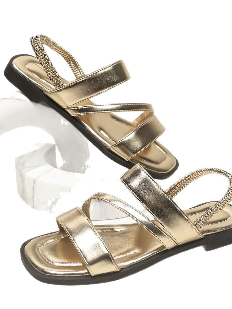 Melba Lane - gold cross strap flat sandals, studio pair view from the side, AU women's sizes