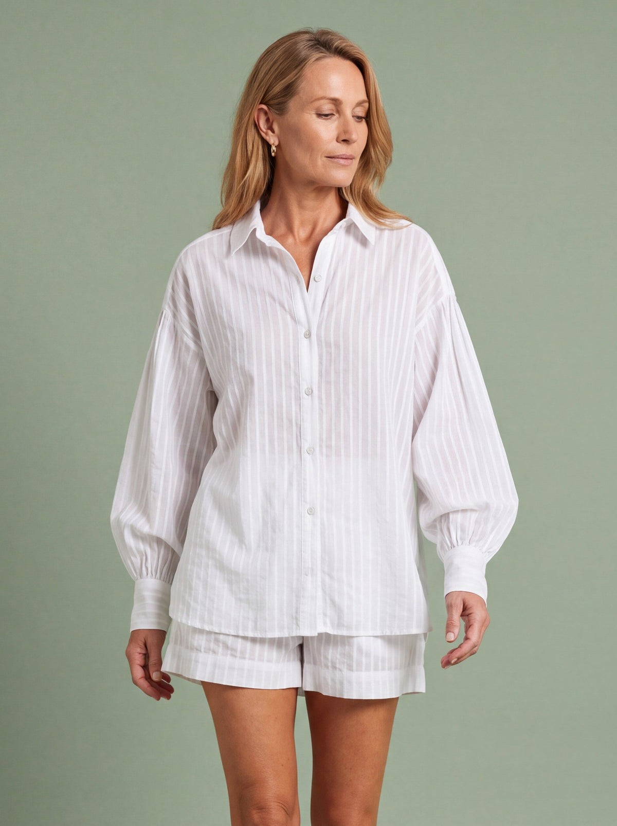 Woman wearing a striped shirt and shorts set for a summer barbecue