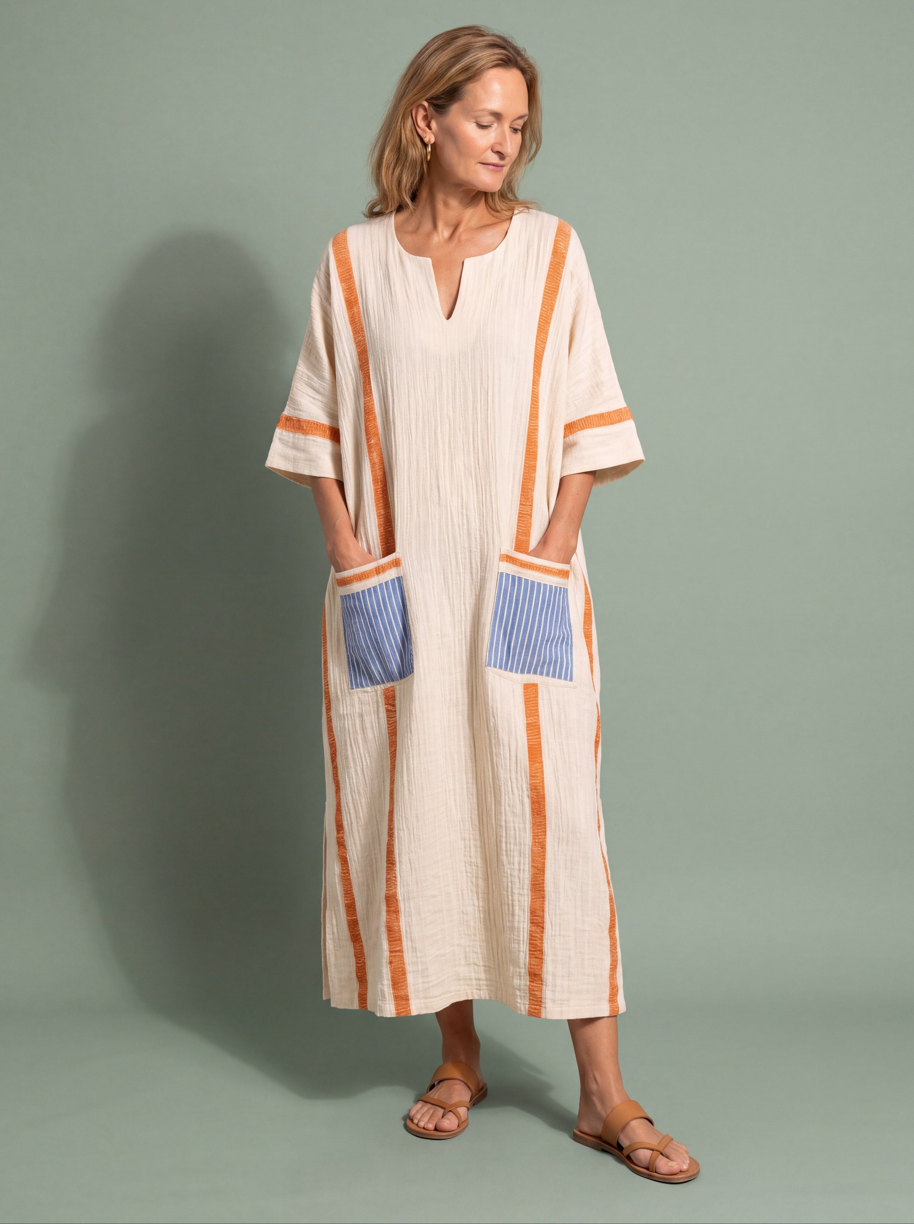 Woman wearing a wide sleeve resort maxi dress for a cruise