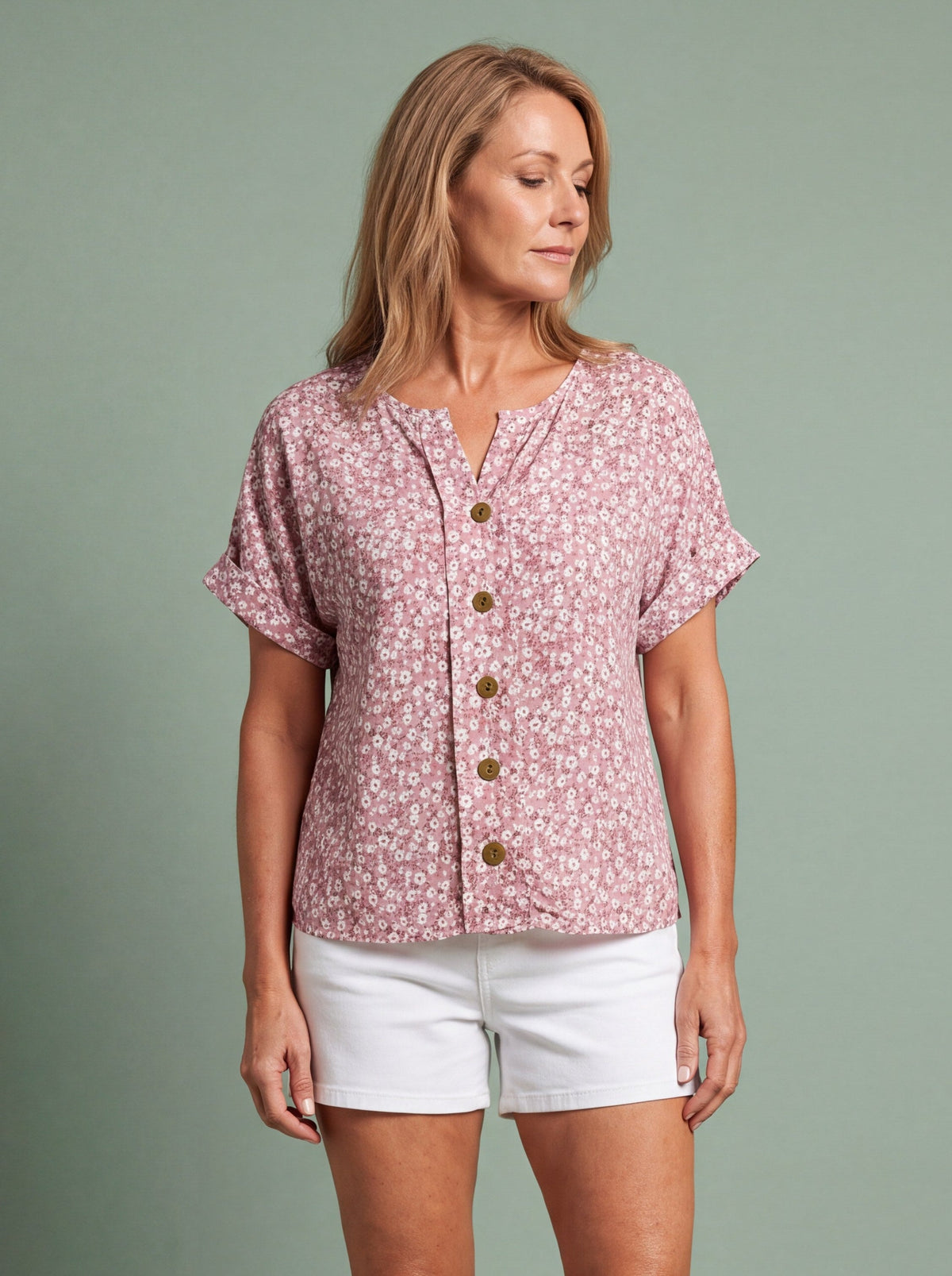 Woman wearing a relaxed button through blouse for a summer office outfit