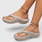 Melba Lane – taupe grey cushioned thong sandals worn stepping forward, AU women's sizes