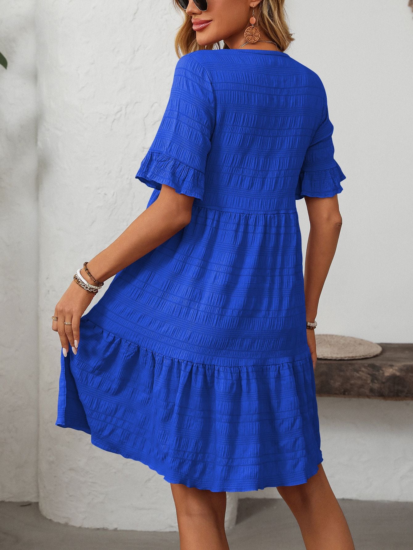Melba Lane – Studland royal blue textured tiered short-sleeve dress, cropped front view of the tiered skirt, AU women's sizes