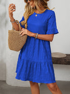 Melba Lane – Studland royal blue textured tiered short-sleeve dress, front view with a straw tote on the forearm, AU women's sizes