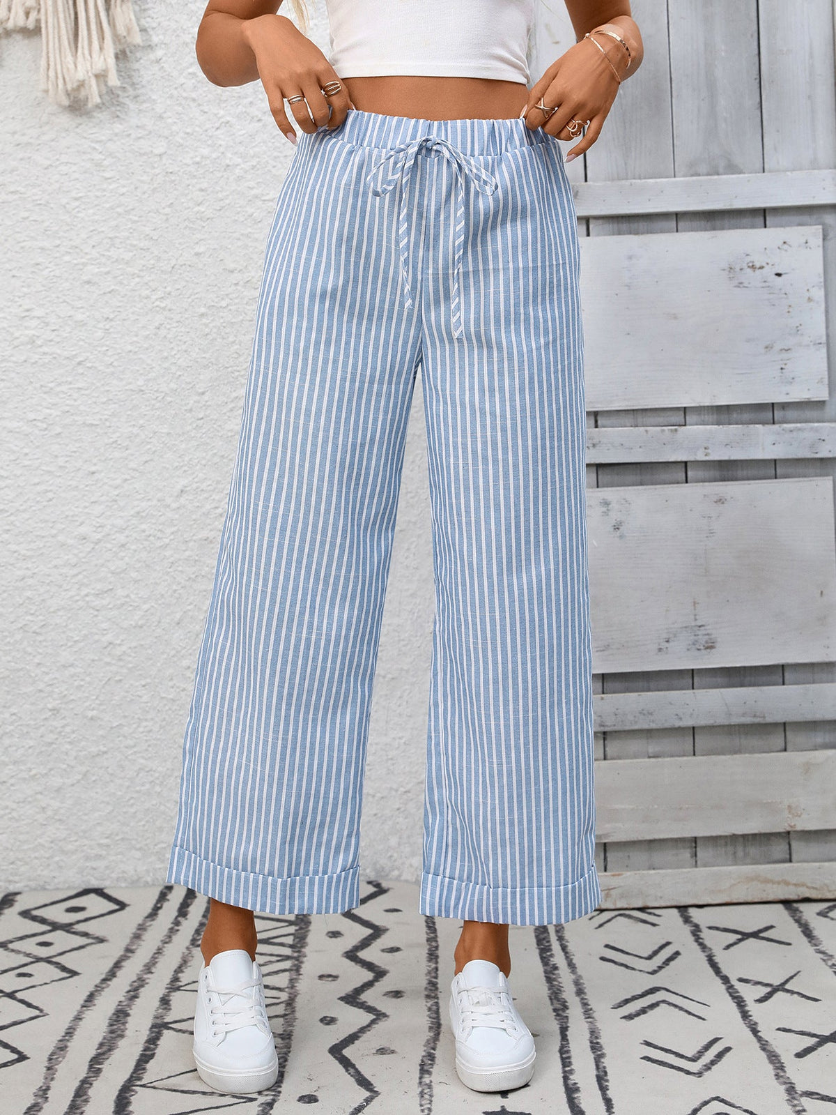 Melba Lane – Devizes light blue striped cropped wide-leg pants, front view with hands at the waistband, AU women's sizes