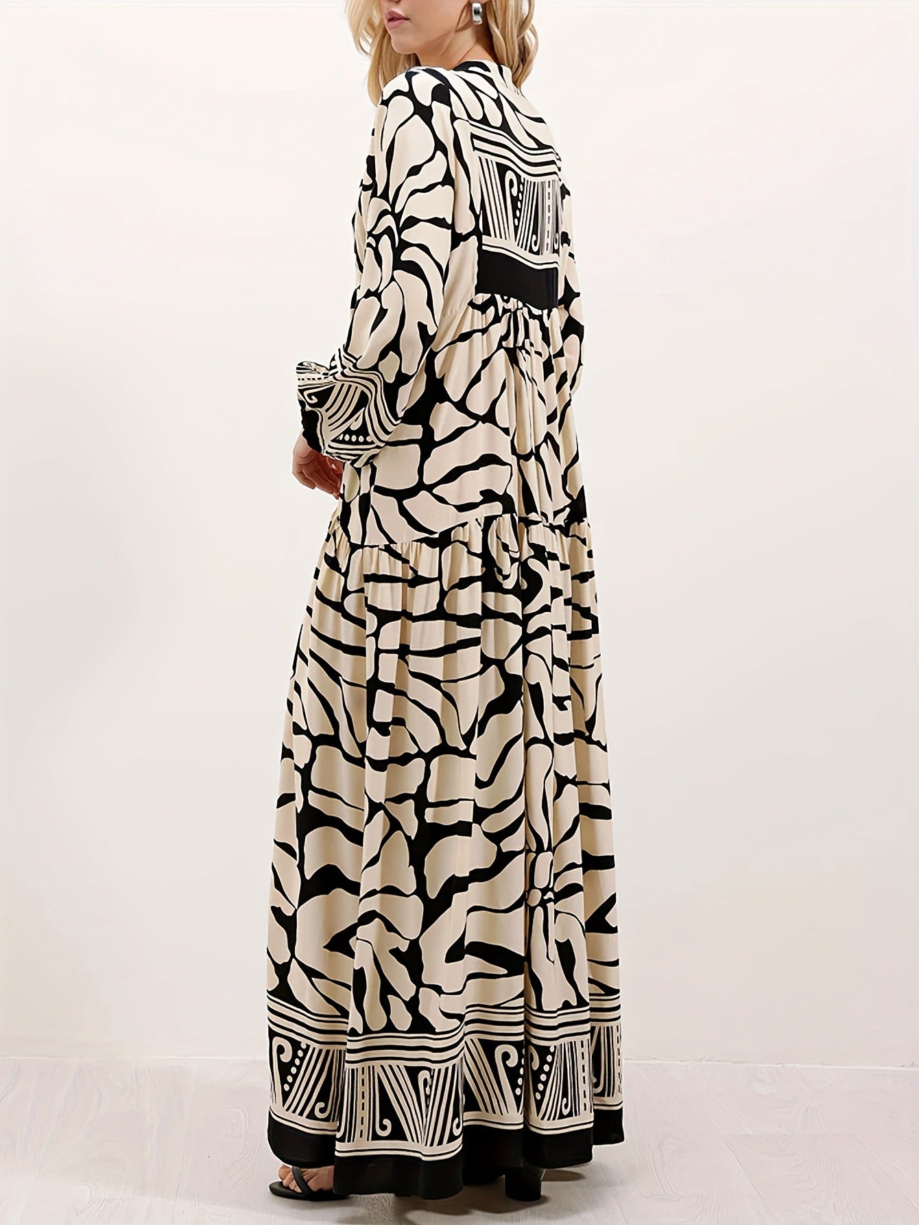 Melba Lane – cream and black print maxi dress worn with a clutch bag, AU women's sizes