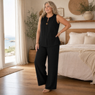 Melba Lane – Sperlonga black sleeveless set with wide-leg pants, worn indoors, AU women's sizes
