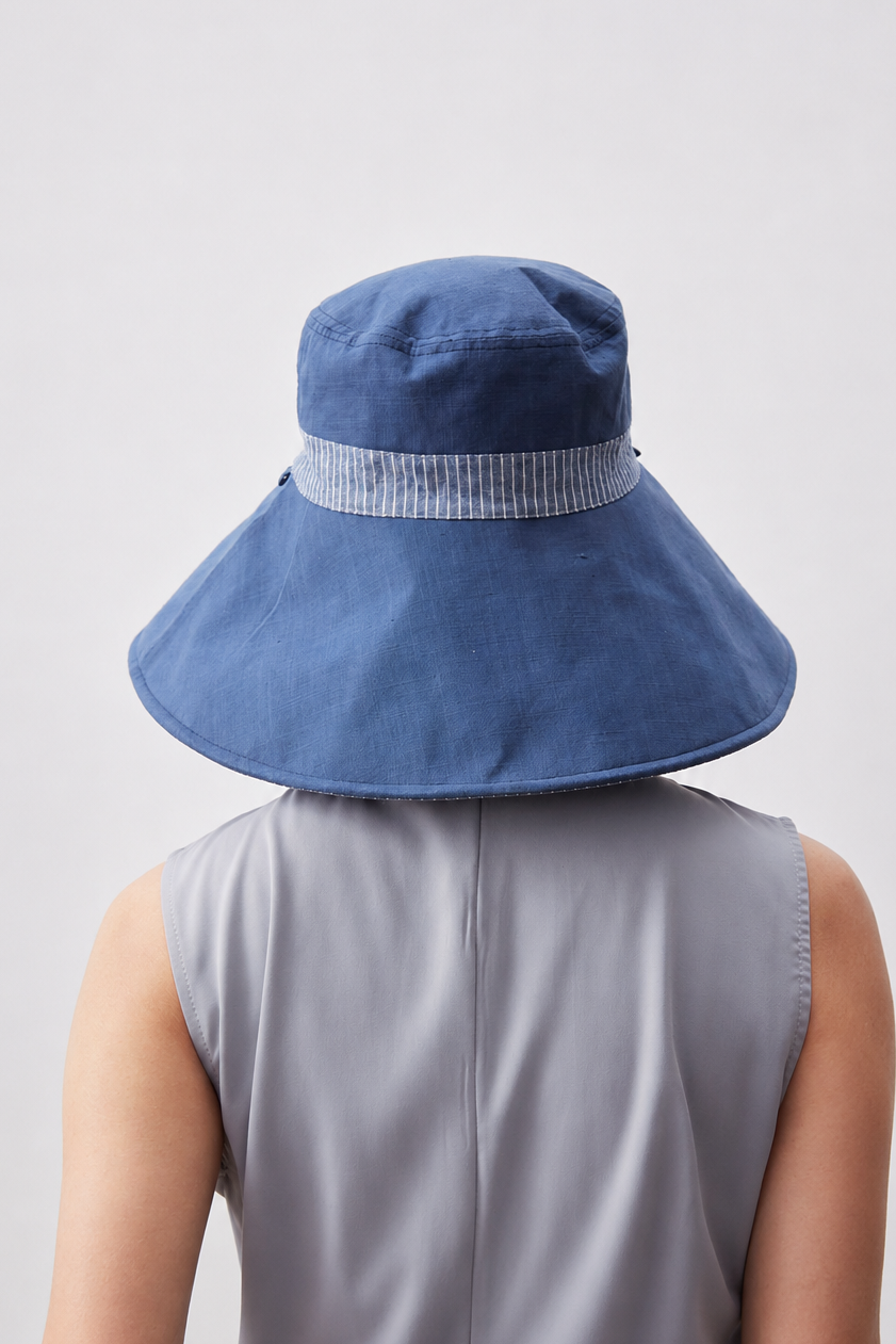 Melba Lane – Kythira blue reversible wide-brim bucket sun hat from the back, striped band wrapping the crown