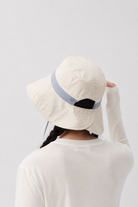 Melba Lane – Tinos light blue reversible bucket sun hat from the back, showing the split brim and adjustable back tab