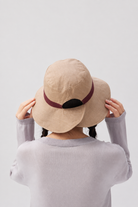 Melba Lane – Tinos tan side of the reversible sun hat from the back, burgundy band and split brim visible